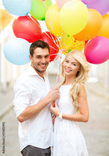 Photo: couple with colorful balloons couple with colorful balloons