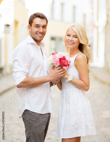 Photo: couple with flowers in the city couple with flowers in the city
