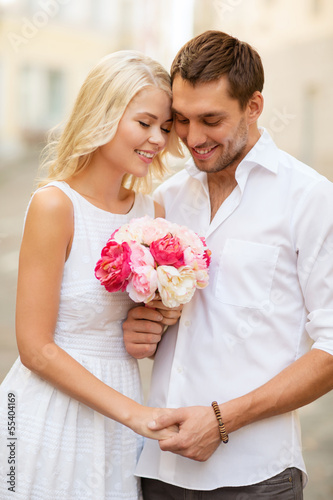 Photo: couple with flowers in the city couple with flowers in the city