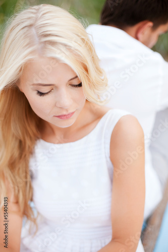 Photo: stressed woman with man outside stressed woman with man outside
