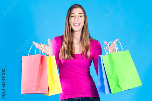 Photo: woman with colored shopping bags woman with colored shopping bags