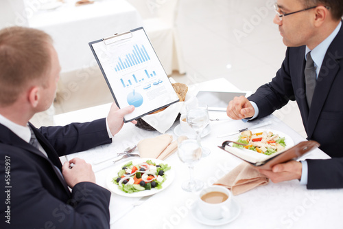 Photo: Discussing paper at lunch Discussing paper at lunch