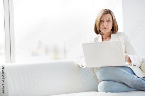 Photo: Woman using laptop Woman using laptop