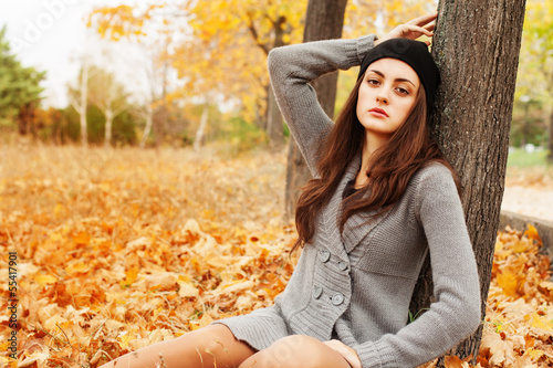 Photo: Autumn woman on leafs background Autumn woman on leafs background