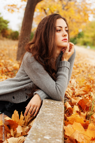 Photo: Autumn woman on leafs background Autumn woman on leafs background