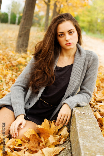 Photo: Autumn woman on leafs background Autumn woman on leafs background