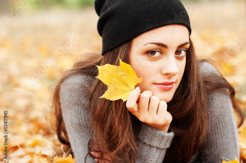 Photo: Autumn woman on leafs background Autumn woman on leafs background