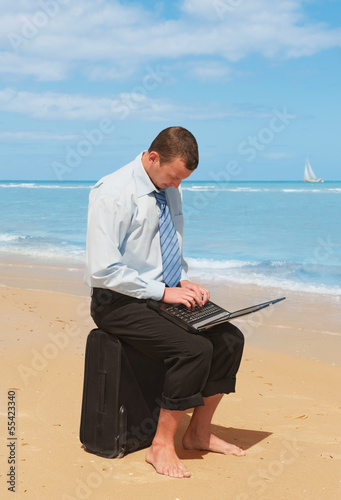 Photo: businessman on the beach businessman on the beach