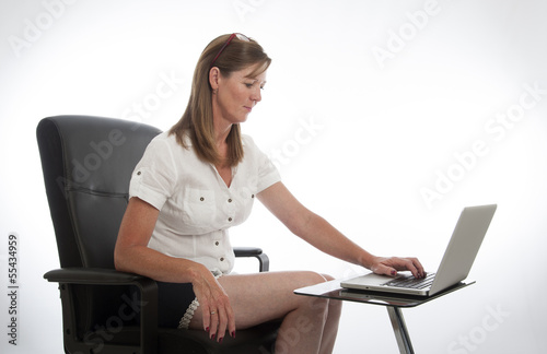 Photo: Female office worker and computer Female office worker and computer