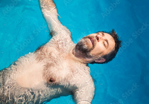 Photo: Middle-aged man in a swimming pool Middle-aged man in a swimming pool