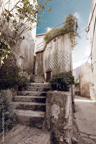 Photo: Beautiful mediterranean old stairs in Vrbnik Town Croatia Beautiful mediterranean old stairs in Vrbnik Town Croatia