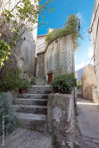 Photo: Beautiful mediterranean old stairs in Vrbnik Town Croatia Beautiful mediterranean old stairs in Vrbnik Town Croatia