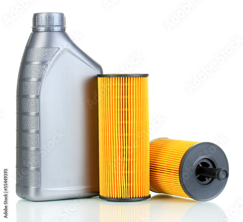 Photo: Car oil filters and motor oil can isolated on white Car oil filters and motor oil can isolated on white