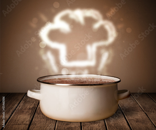 Photo: Chef hat above cooking pot Chef hat above cooking pot