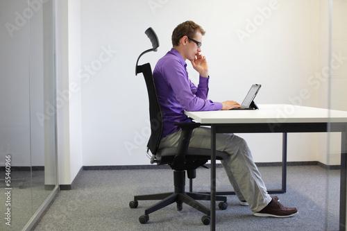 Photo: correct sitting position at desk with tablet correct sitting position at desk with tablet