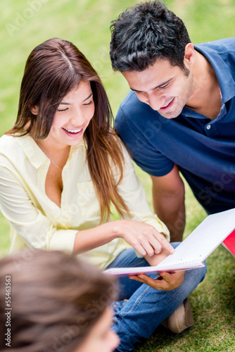 Photo: Couple studying outdoors Couple studying outdoors