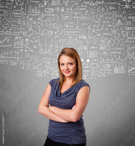 Photo: Young pretty lady with hand drawn calculations and icons Young pretty lady with hand drawn calculations and icons