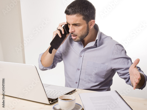 Photo: Young Man with Beard working on Laptop Young Man with Beard working on Laptop