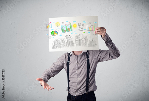 Photo: Businessman holding a paper with charts and cityscape in front o Businessman holding a paper with charts and cityscape in front o