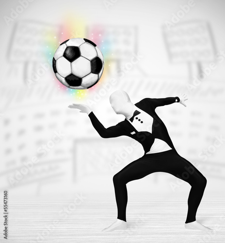 Photo: man in full body suit holdig soccer ball man in full body suit holdig soccer ball