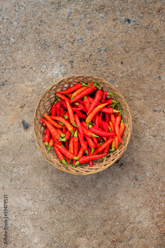 Photo: Red Chillies on Basket Top View Red Chillies on Basket Top View