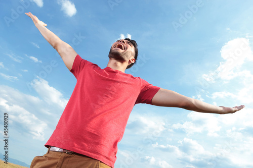 Photo: casual man screaming at the sky casual man screaming at the sky
