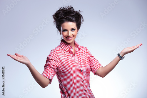 Photo: young casual woman welcoming you young casual woman welcoming you
