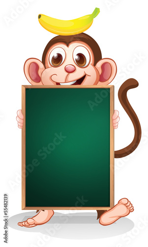 Vector: A monkey with a banana on his head holding an empty blackboard A monkey with a banana on his head holding an empty blackboard