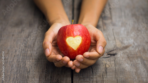 Photo: Red Apple with engraved heart Red Apple with engraved heart