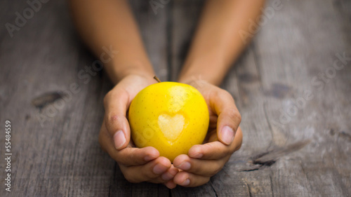 Photo: Yellow Apple with engraved heart Yellow Apple with engraved heart