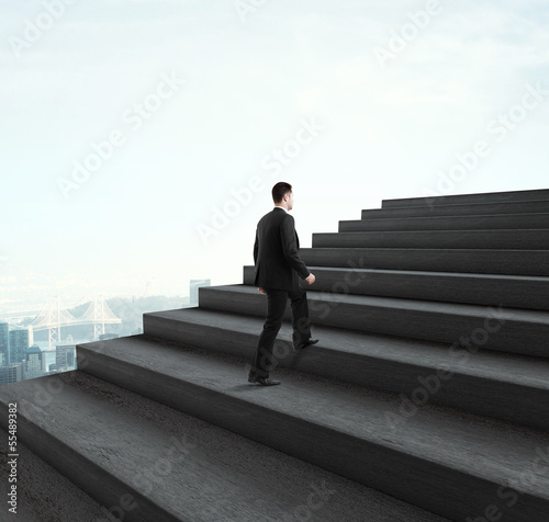 Photo: man walking near ladder man walking near ladder