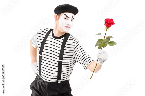 Photo: Mime artist giving a rose flower Mime artist giving a rose flower
