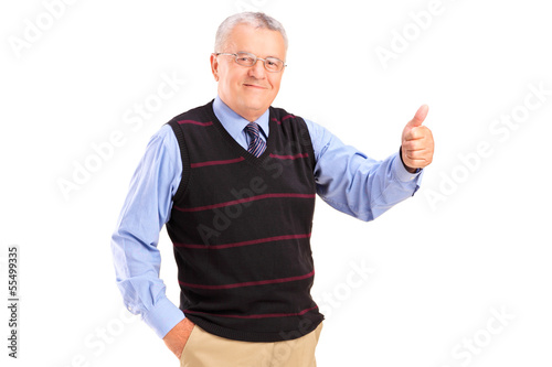 Photo: Smiling mature man giving a thumb up Smiling mature man giving a thumb up