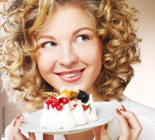 Photo: young woman with a cake young woman with a cake