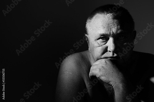 Photo: Dramatic close up portrait of depressed old man Dramatic close up portrait of depressed old man