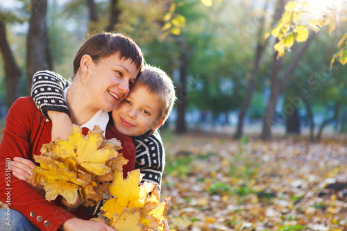 Photo: Mother and her son in a autumn park Mother and her son in a autumn park
