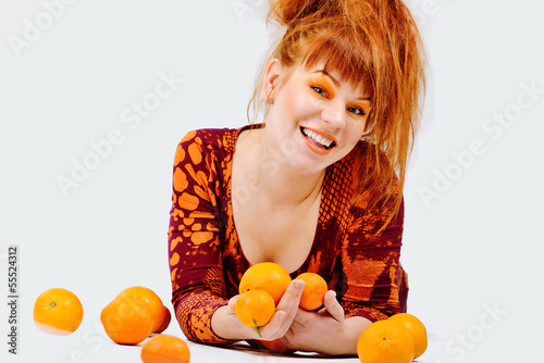 Photo: redhead girl with oranges redhead girl with oranges