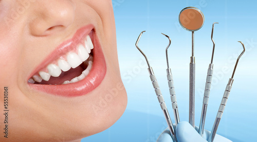 Photo: Teeth with dental tools. Teeth with dental tools.