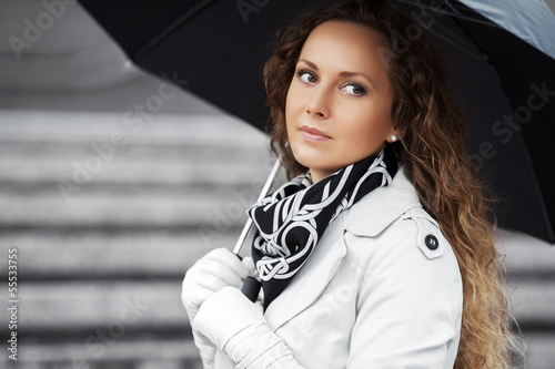 Photo: Beautiful woman with umbrella in the rain Beautiful woman with umbrella in the rain