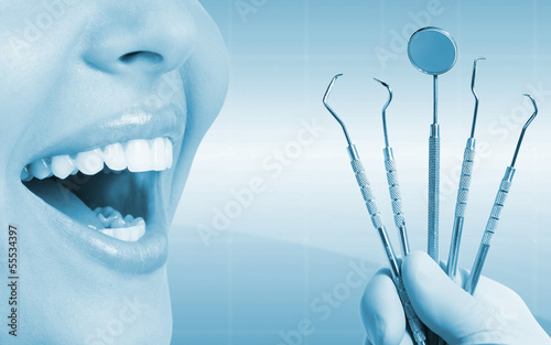 Photo: Teeth with dental tools. Teeth with dental tools.