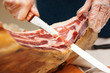 Waiter is slicing jamon (prosciutto) Waiter is slicing jamon (prosciutto)
