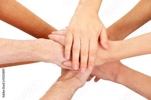 Photo: United hands isolated on white Conceptual photo of teamwork United hands isolated on white Conceptual photo of teamwork