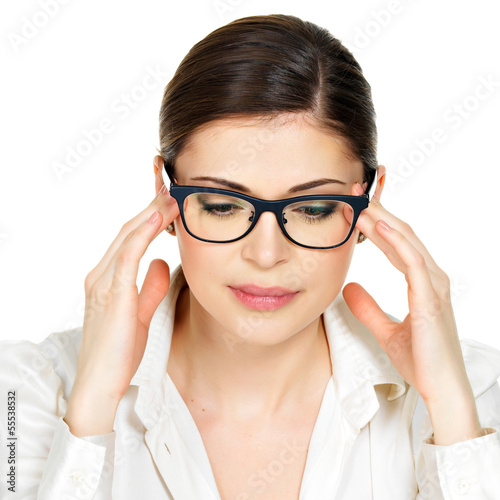 Photo: Portrait of a young woman in glasses with headache Portrait of a young woman in glasses with headache