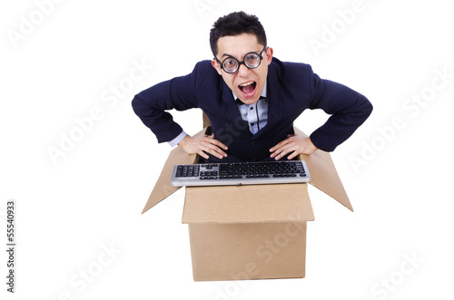 Photo: Funny computer geek sitting in the box Funny computer geek sitting in the box