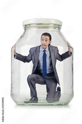 Photo: Young businessman in glass jar Young businessman in glass jar