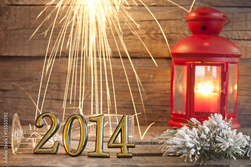 Photo: 2014 happy new year abstract background sign with sparklers 2014 happy new year abstract background sign with sparklers