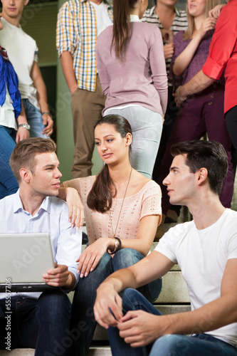 Photo: Students sitting on high-school stairs in break Students sitting on high-school stairs in break