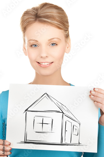 Photo: woman holding picture with house woman holding picture with house