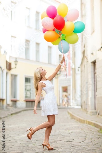 Photo: woman with colorful balloons woman with colorful balloons
