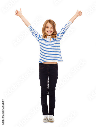 Photo: cute little girl showing thumbs up cute little girl showing thumbs up